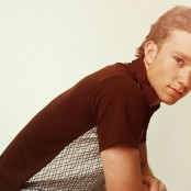 Ty Myers in a black and patterned polo shirt